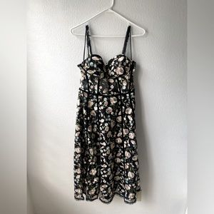 Corset-style shear black formal midi dress.